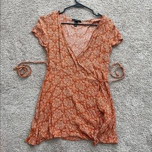 Orange patterned wrap dress